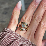 Hand modeling an engagement ring stacked with two wide 14k yellow gold bands
