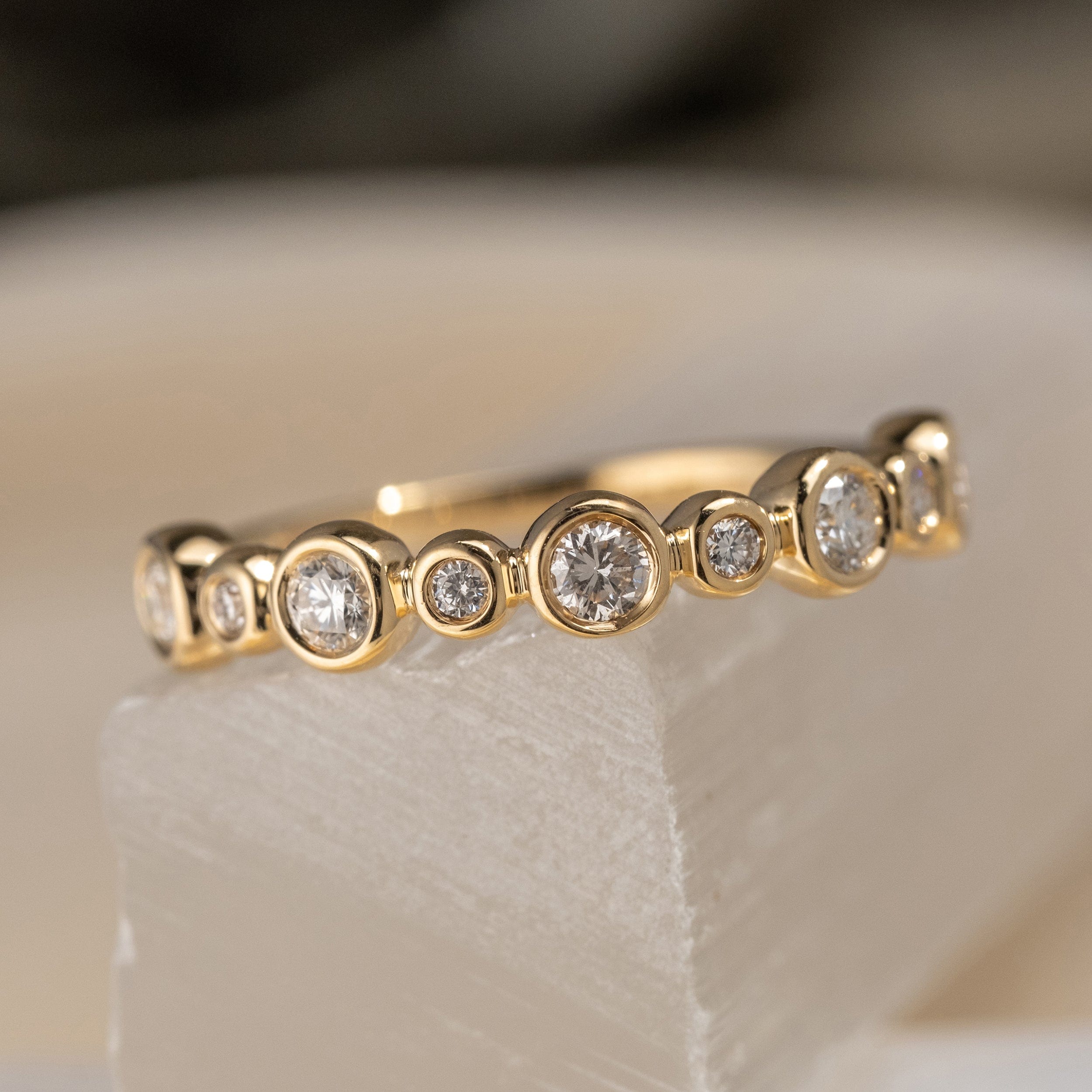 Diamond and 14k yellow gold bezel set wedding band