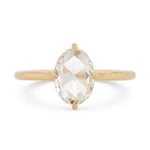 Rose cut oval diamond in a 14k yellow gold solitaire engagement ring setting