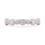Diamond and 14k white gold bezel set wedding band