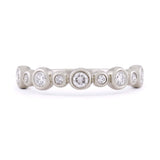 Diamond and 14k white gold bezel set wedding band