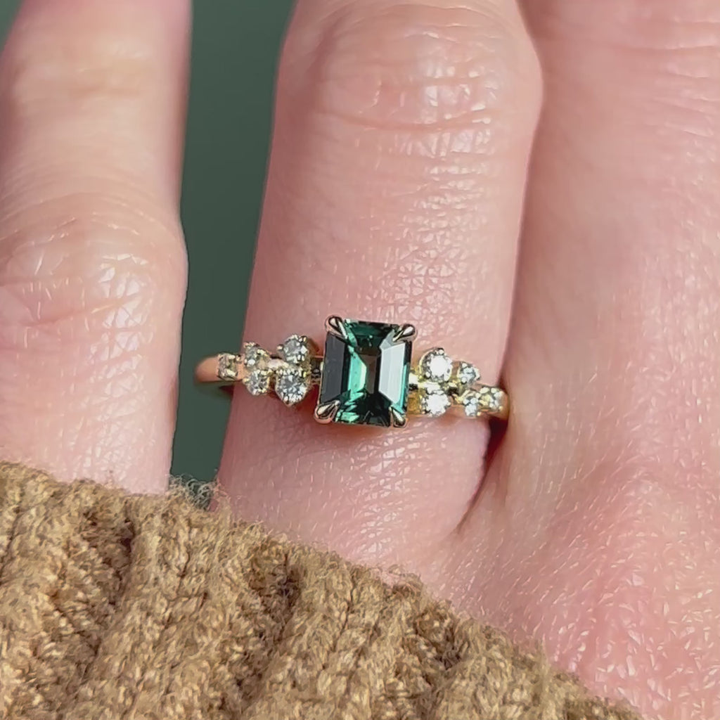 Teal emerald cut engagement ring