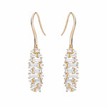 baguette earrings alternating as they dangle from north to south