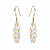 baguette earrings alternating as they dangle from north to south