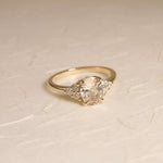 Peach oval sapphire with diamond accents 14k yellow gold engagement ring