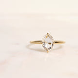 Rose cut E/VS2 oval diamond in a 14k yellow gold solitaire engagement ring setting