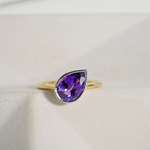 Purple pear sapphire bezel set engagement ring