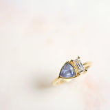 Toi-et-moi baguette diamond and periwinkle blue Montana sapphire engagement ring set in 14k yellow gold