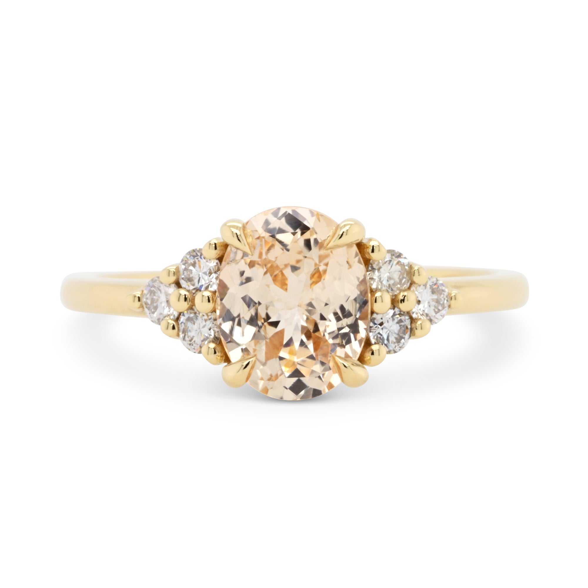 Peach oval sapphire with diamond accents 14k yellow gold engagement ring
