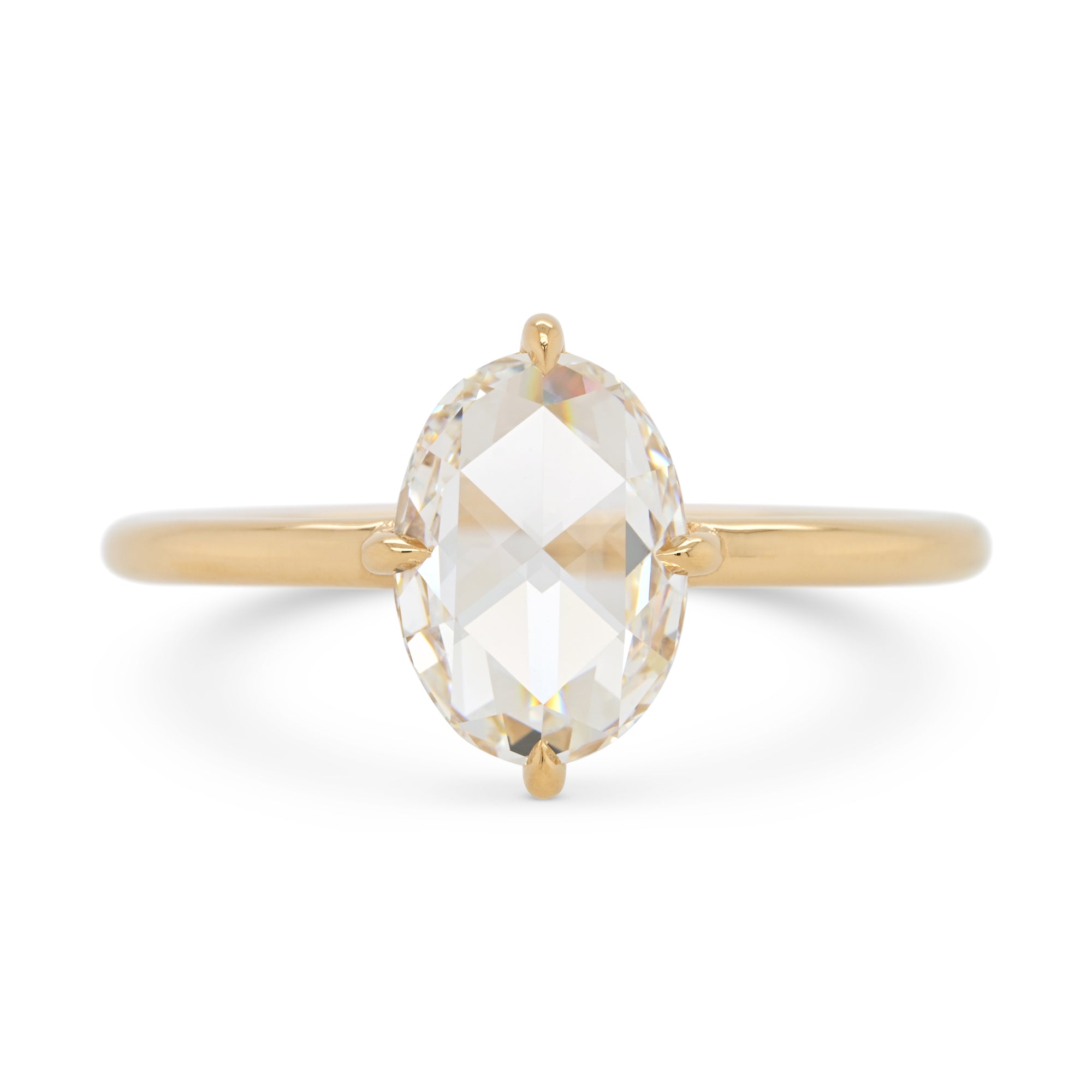 Rose cut oval diamond in a 14k yellow gold solitaire engagement ring setting