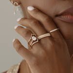 Five 14k yellow gold rings modeled on a hand 