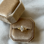 14k yellow gold marquise diamond engagement ring in a velvet ring box