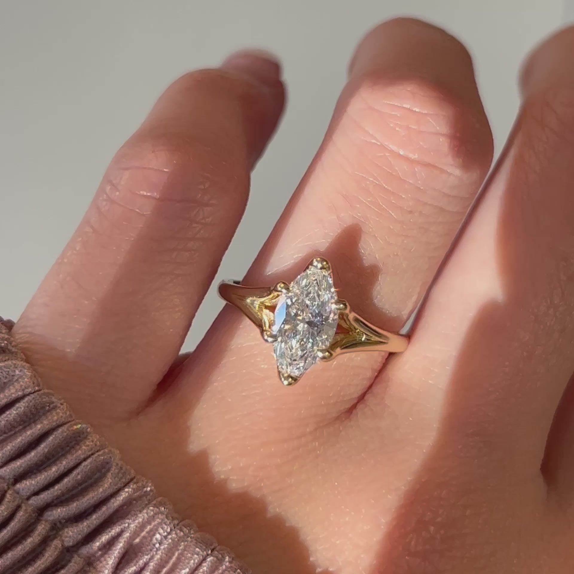 Video of a 14k yellow gold marquise diamond engagement ring