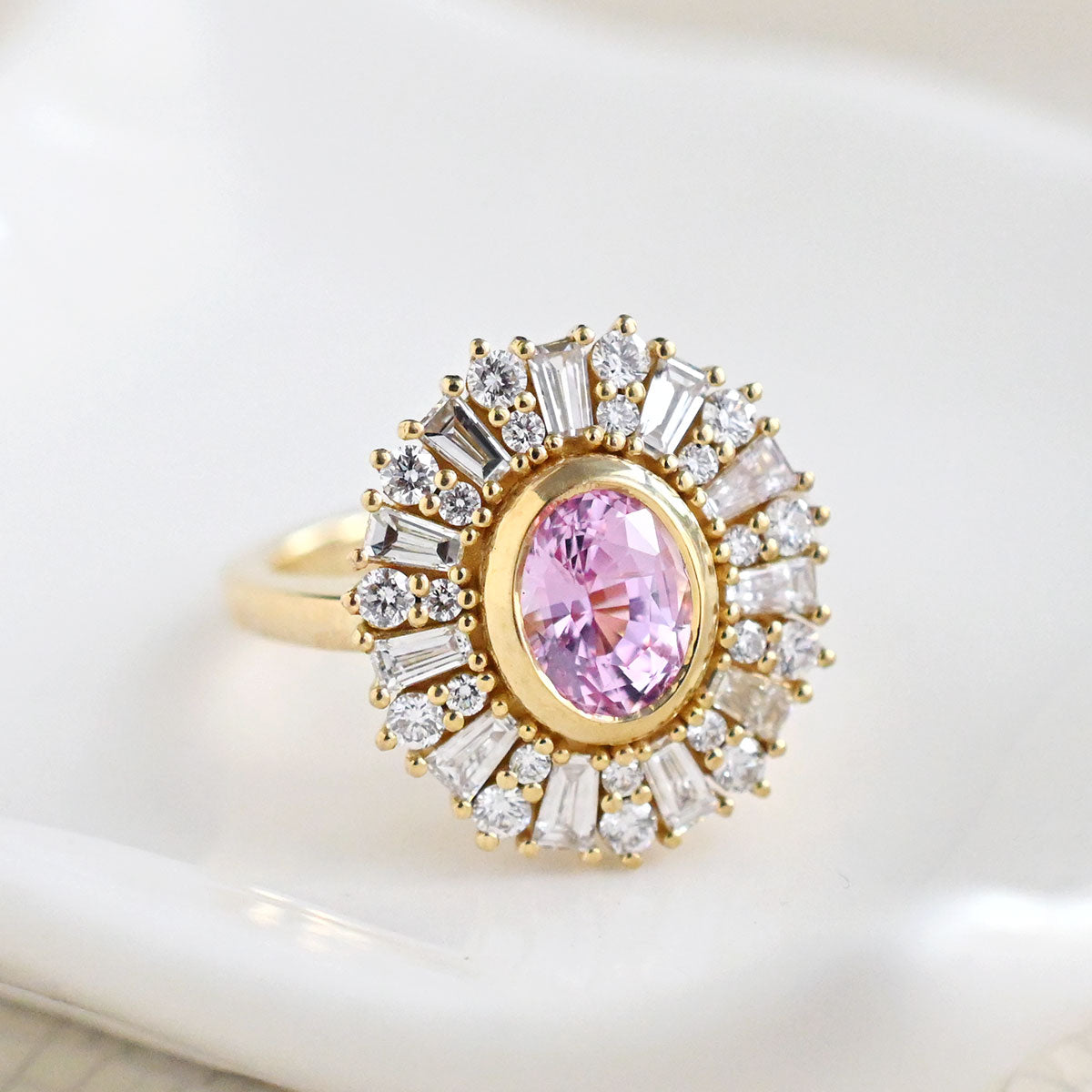 halo bezel pink oval sapphire ring