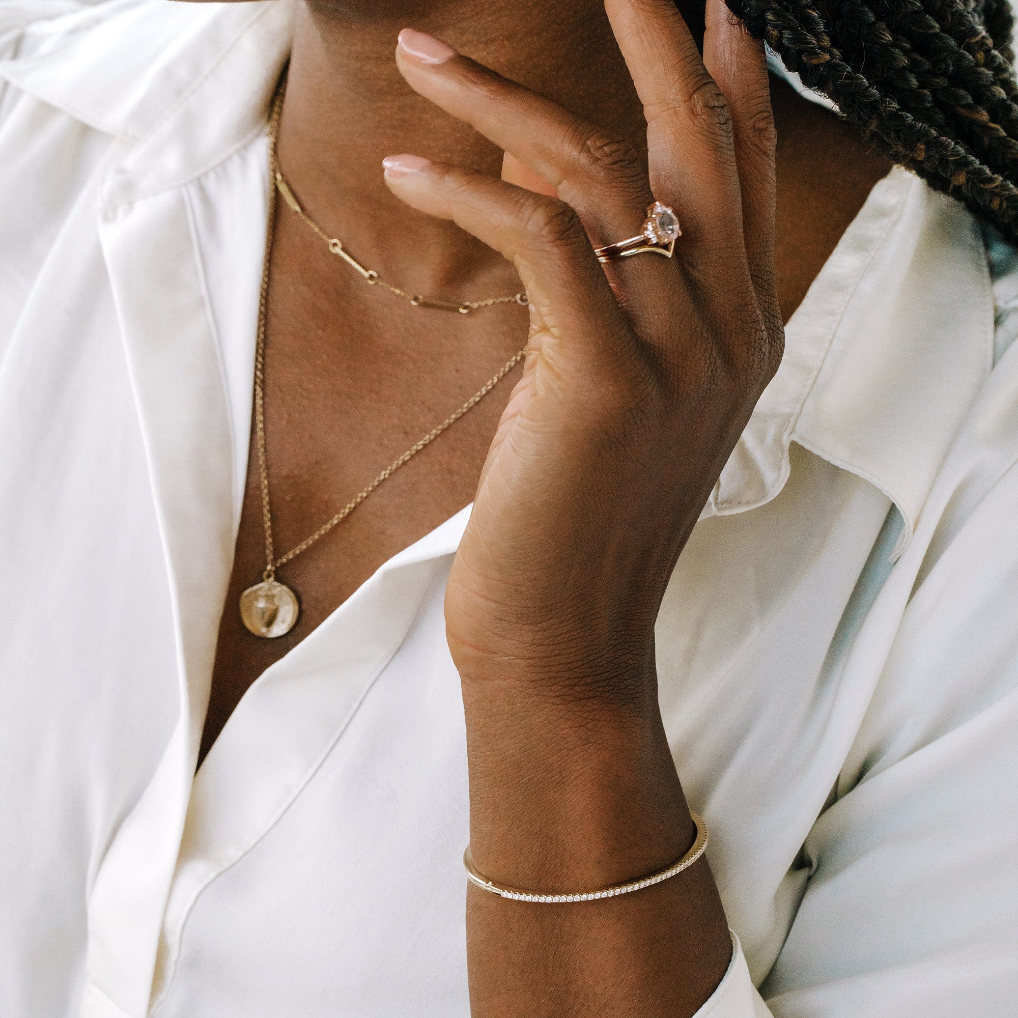 hinged pave bracelet on model with engagement ring and necklace stack