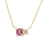 Pink sapphire and white diamond set next to each other on a 14K yellow gold chain 