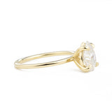 Vera Pear 1.5ct Moissanite Solitaire Engagement Ring at a side view in yellow gold
