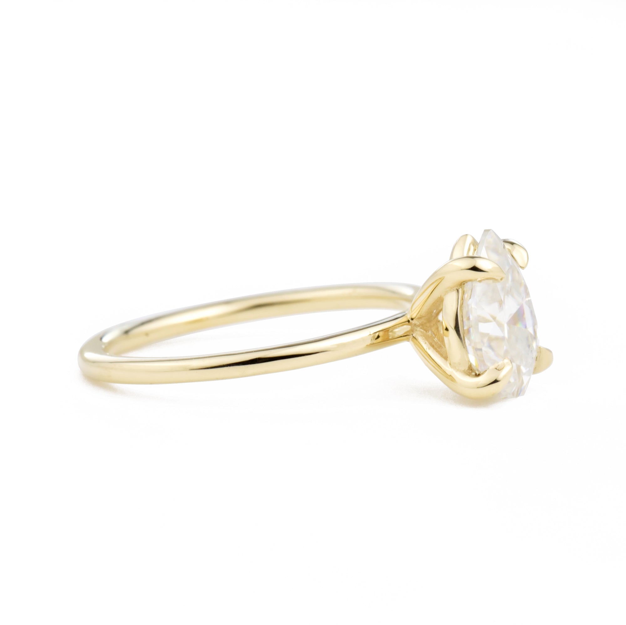 Vera Pear 1.5ct Moissanite Solitaire Engagement Ring at a side view in yellow gold