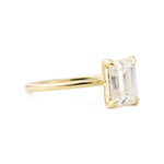 Vera 1.75ct Emerald Cut Moissanite Solitaire Engagement Ring shown from the side in yellow gold