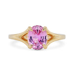 14k yellow gold split shank engagement ring with a lilac magenta oval sapphire