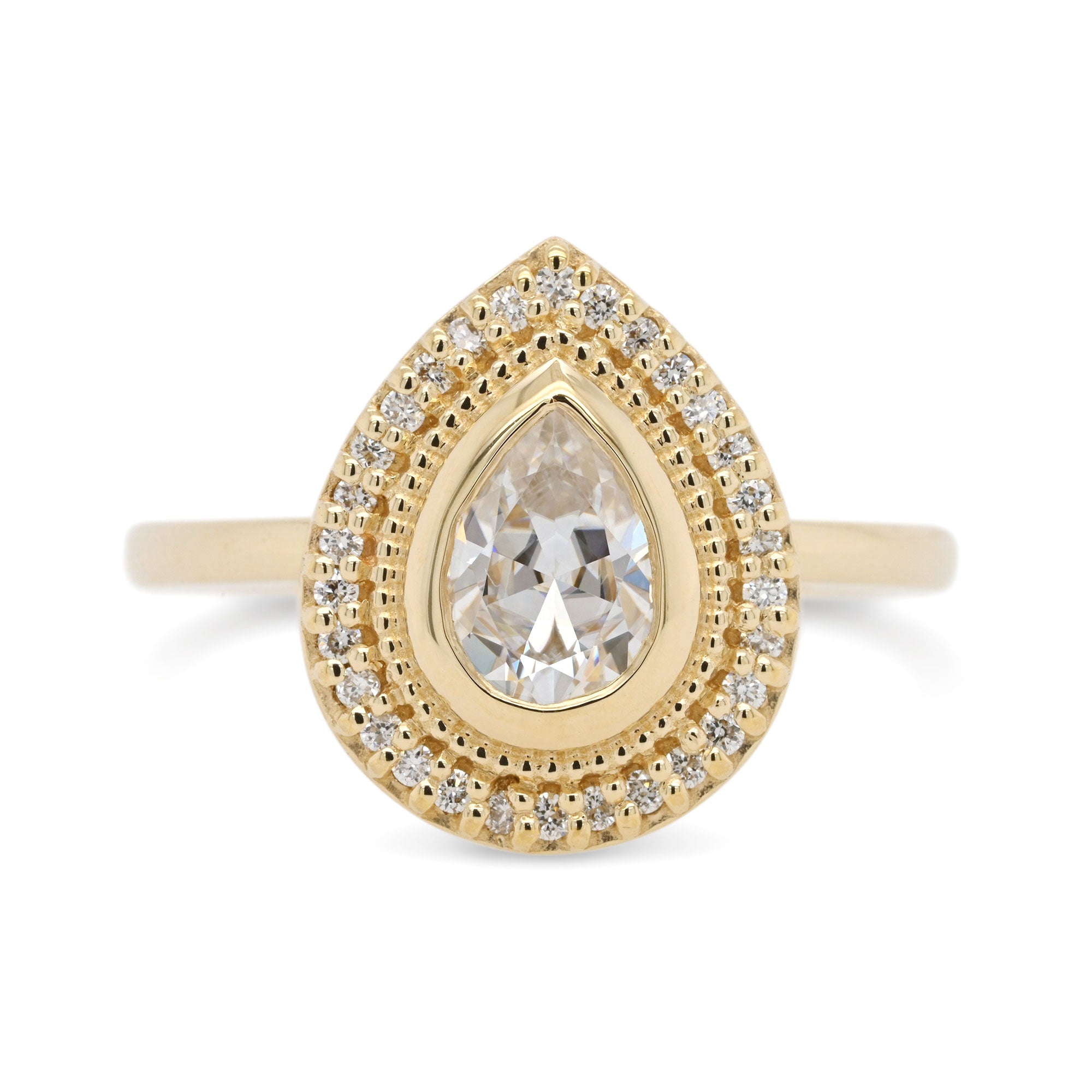 pear moissanite, lab-grown stone set in a halo with pave diamonds