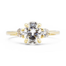 Zara Oval Three Stone Moissanite Engagement Ring in yellow gold