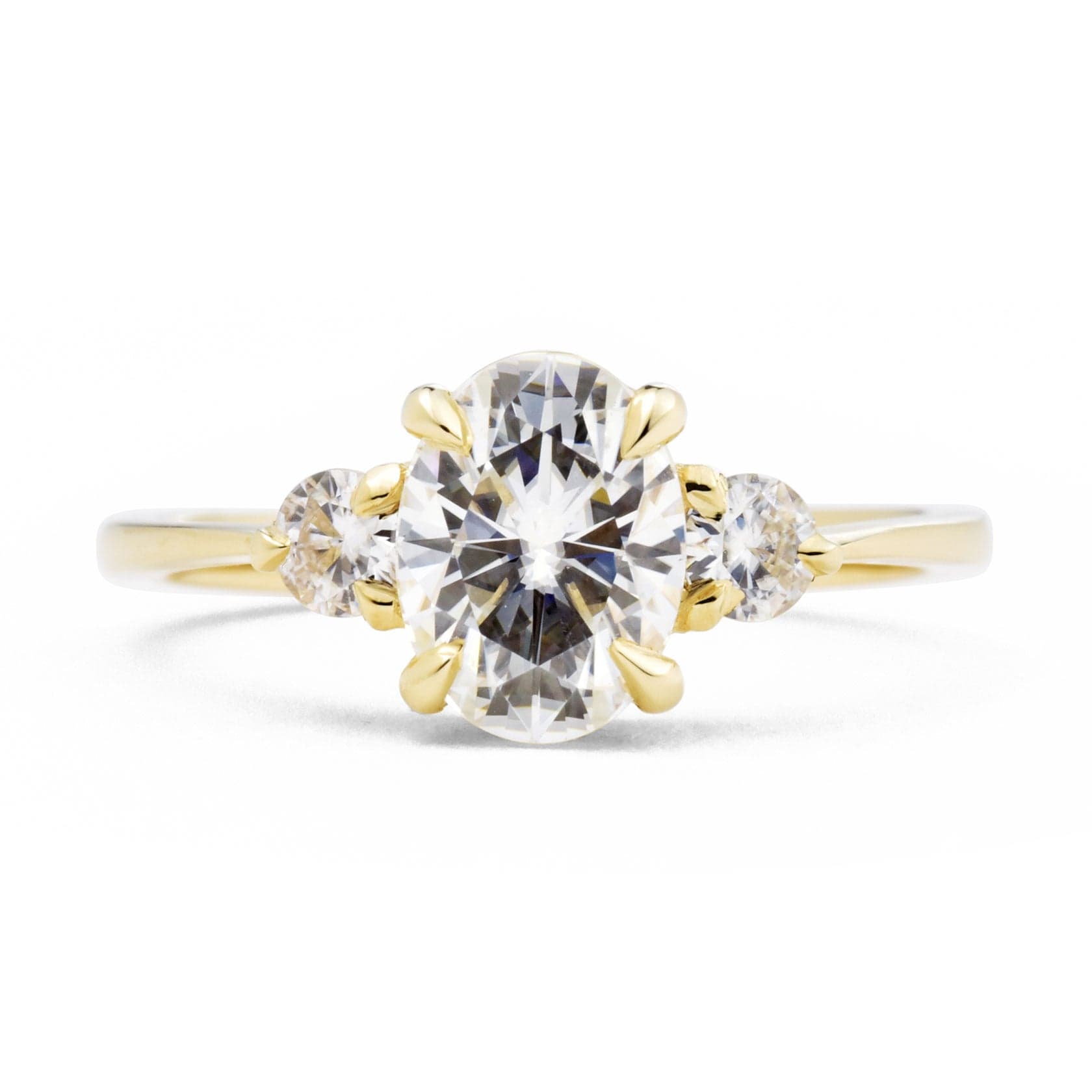 Zara Oval Three Stone Moissanite Engagement Ring in yellow gold